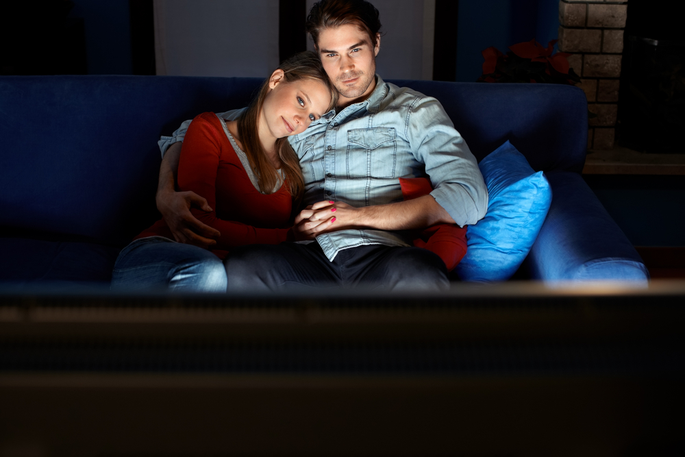 couple watching movie at home